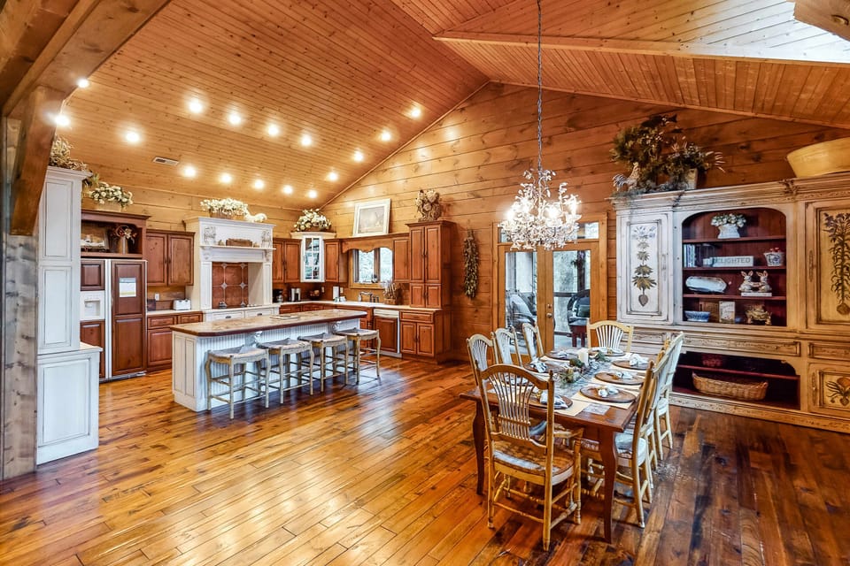 Dining Room & Kitchen awaits. With, stunning wood details and elegant lighting for delightful gatherings!