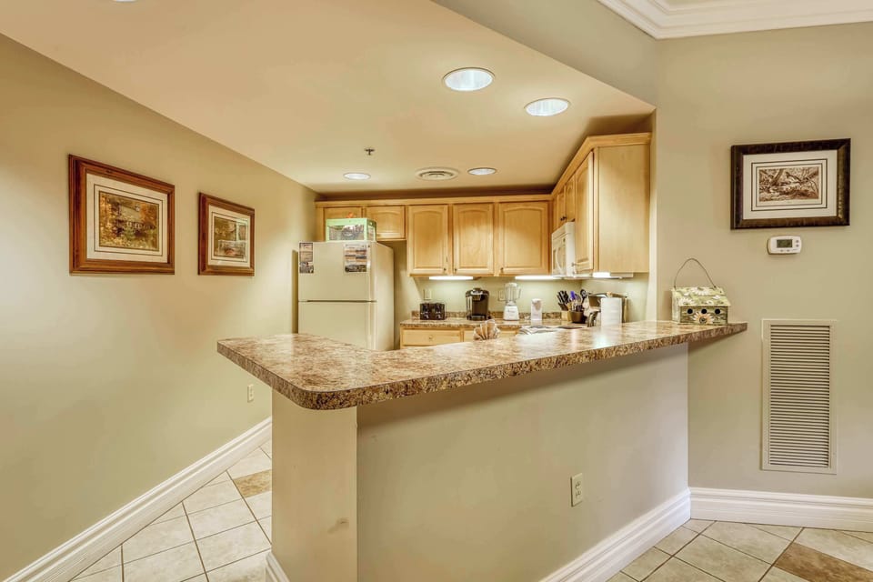 Enjoy meal prep in a bright, fully-equipped kitchen with elegant finishes!