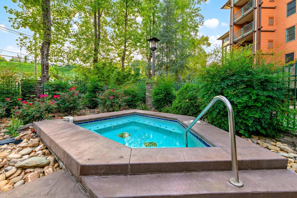 Shared Hot Tub Haven awaits. Soak under the stars in your private oasis surrounded by lush greenery!