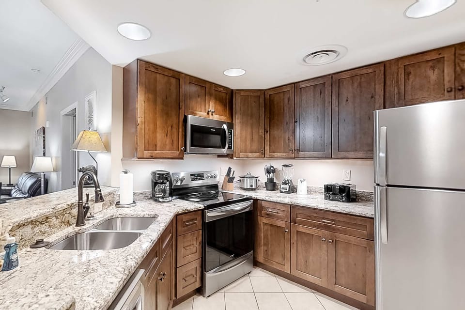 Sleek modern appliances meet rustic charm in this beautiful culinary haven!