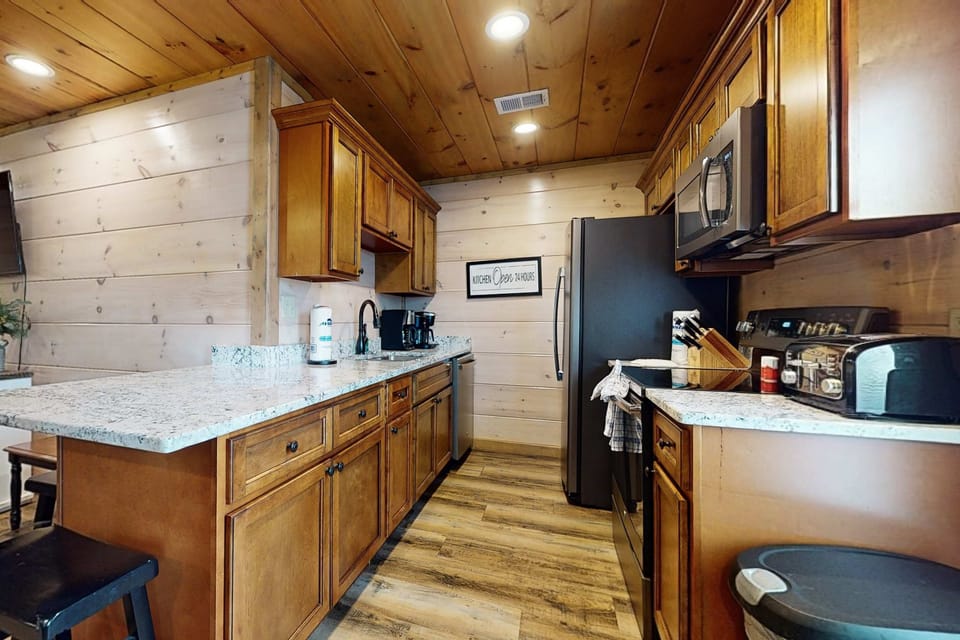 Tastefully designed for culinary adventures with sleek appliances and rustic charm!