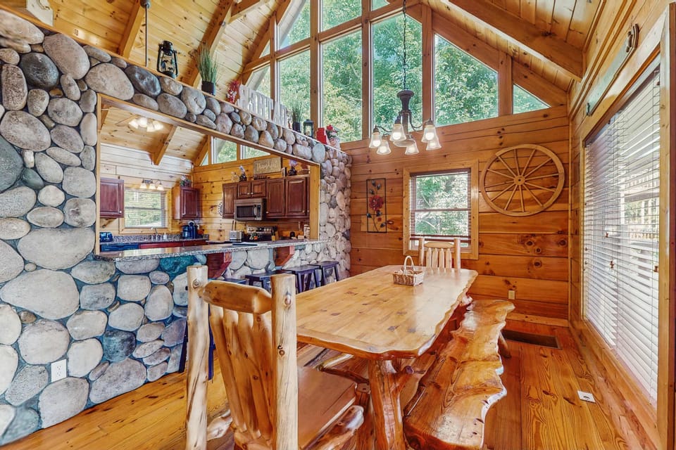 Rustic charm with a stunning stone feature and vibrant nature views awaits!