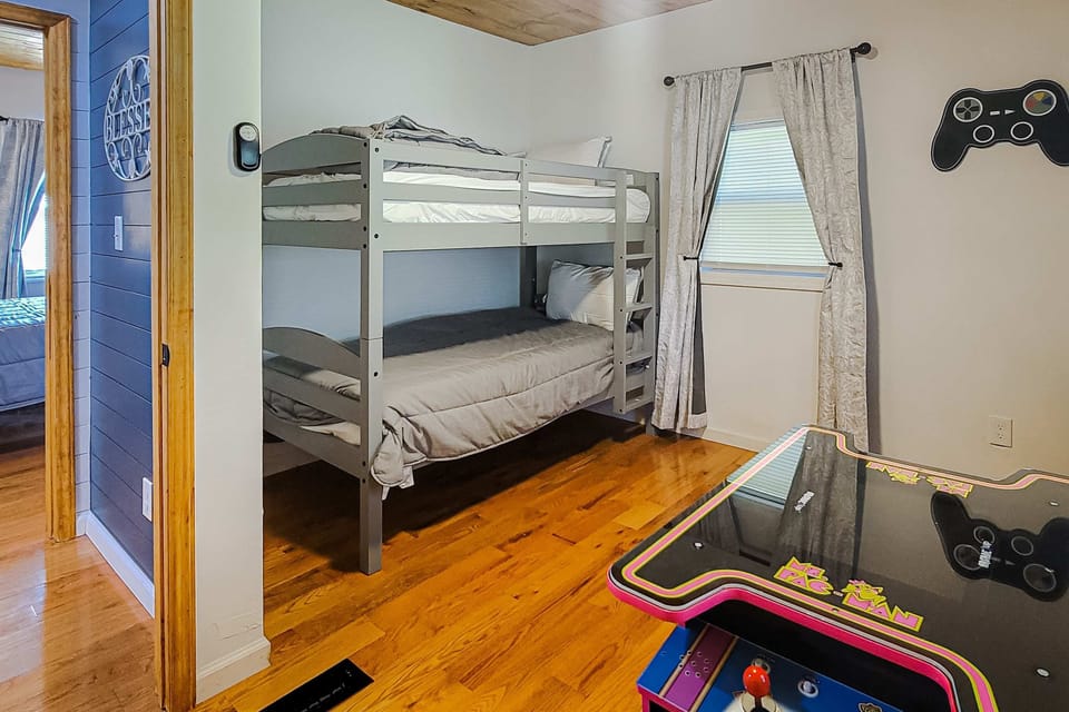 Fun-filled retreat with playful decor and arcade gaming for unforgettable memories!
