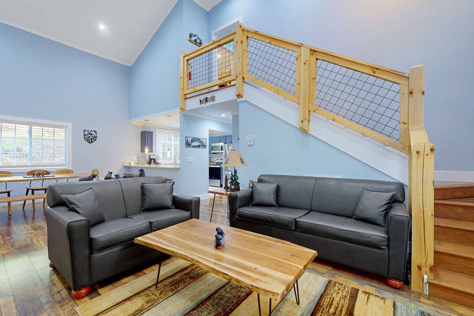 Relax on stylish sofas beneath vaulted ceilings and enjoy woodsy charm!
