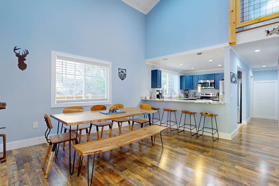 Spacious dining area awaits. And, gather around the rustic table and enjoy meals in style!