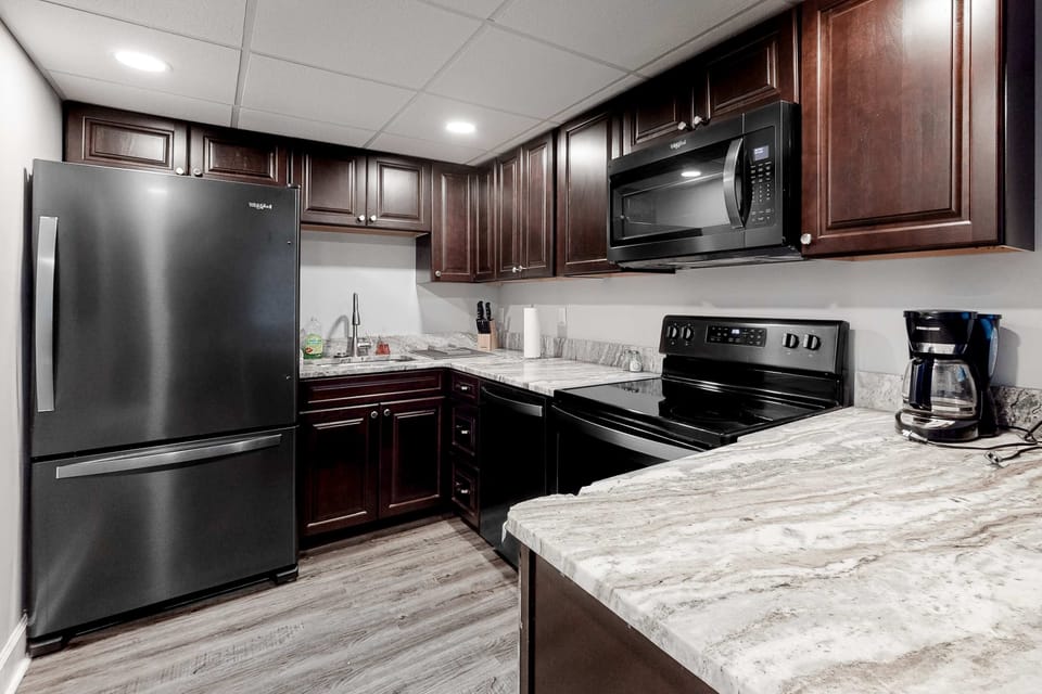 Modern appliances and sleek surfaces perfect for culinary adventures await!