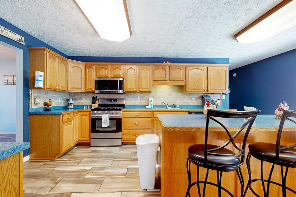 Cook up delicious meals in this bright, spacious kitchen with modern appliances and stylish decor!