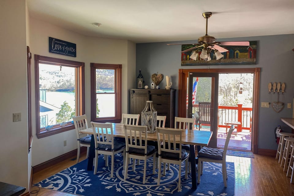 Dining room delight awaits. And, gather around the spacious table with stunning lake views! Enjoy great meals and memories!