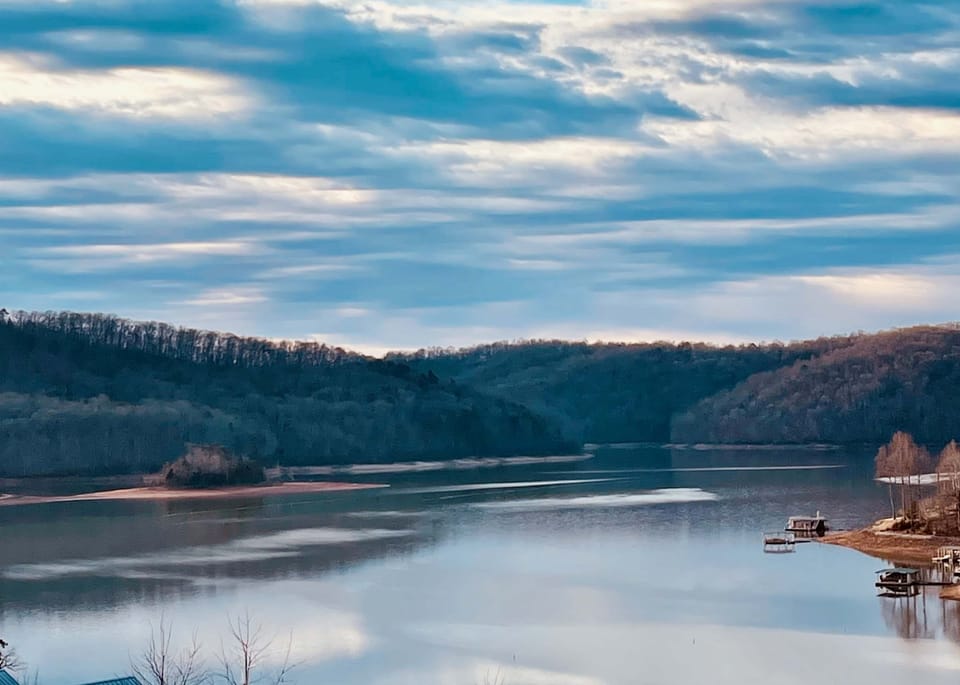 Lakeview paradise awaits. And, revel in stunning sunset views over serene waters and lush hillsides!