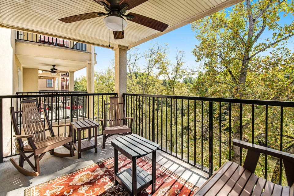 Sip your morning coffee on this scenic balcony, surrounded by lush treetops!