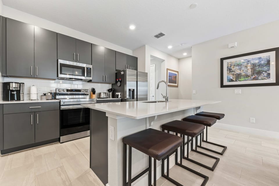 Sleek modern kitchen meets elegant dining – perfect for hosting and creating unforgettable meals in style!