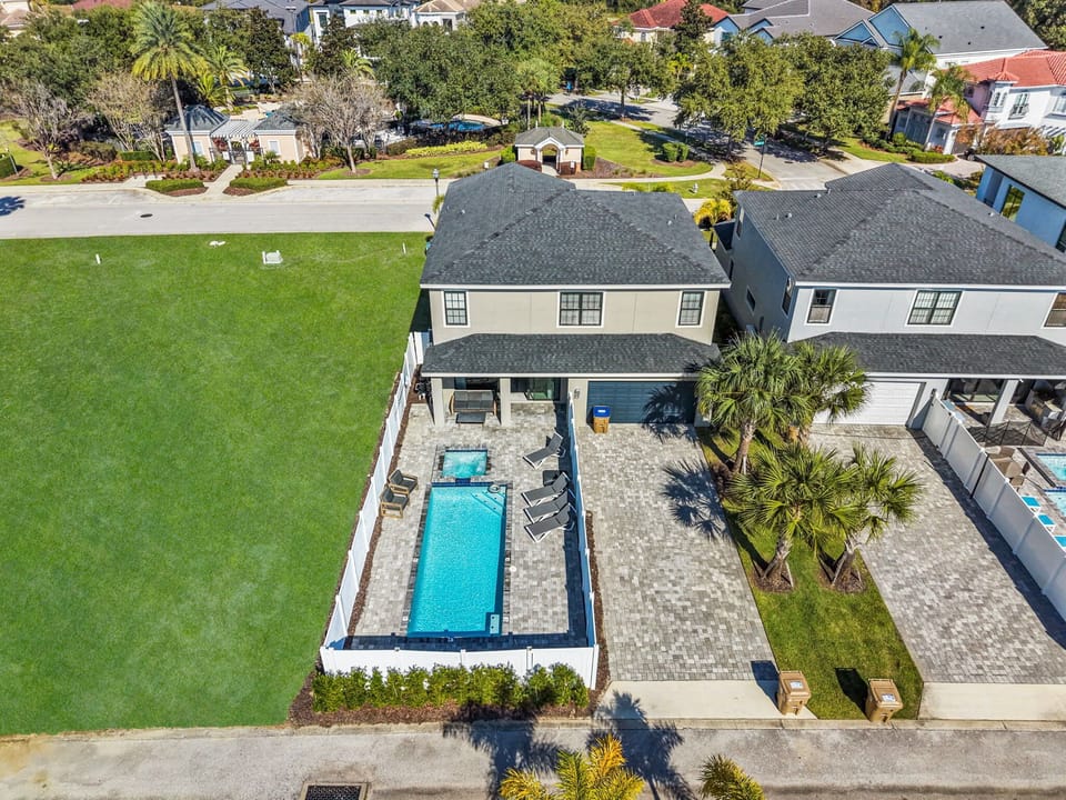 Modern Pool Home with Privacy Fence and Outdoor Seating