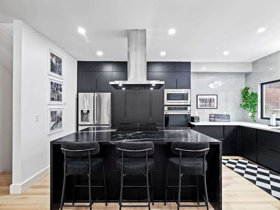 Sleek kitchen w/ stainless appliances ready for easy cooking.
