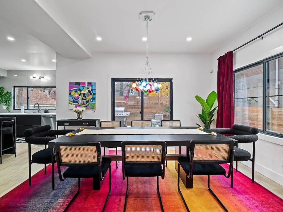 Sunlit dining space framed by lively art & soft textures for easy hangs.