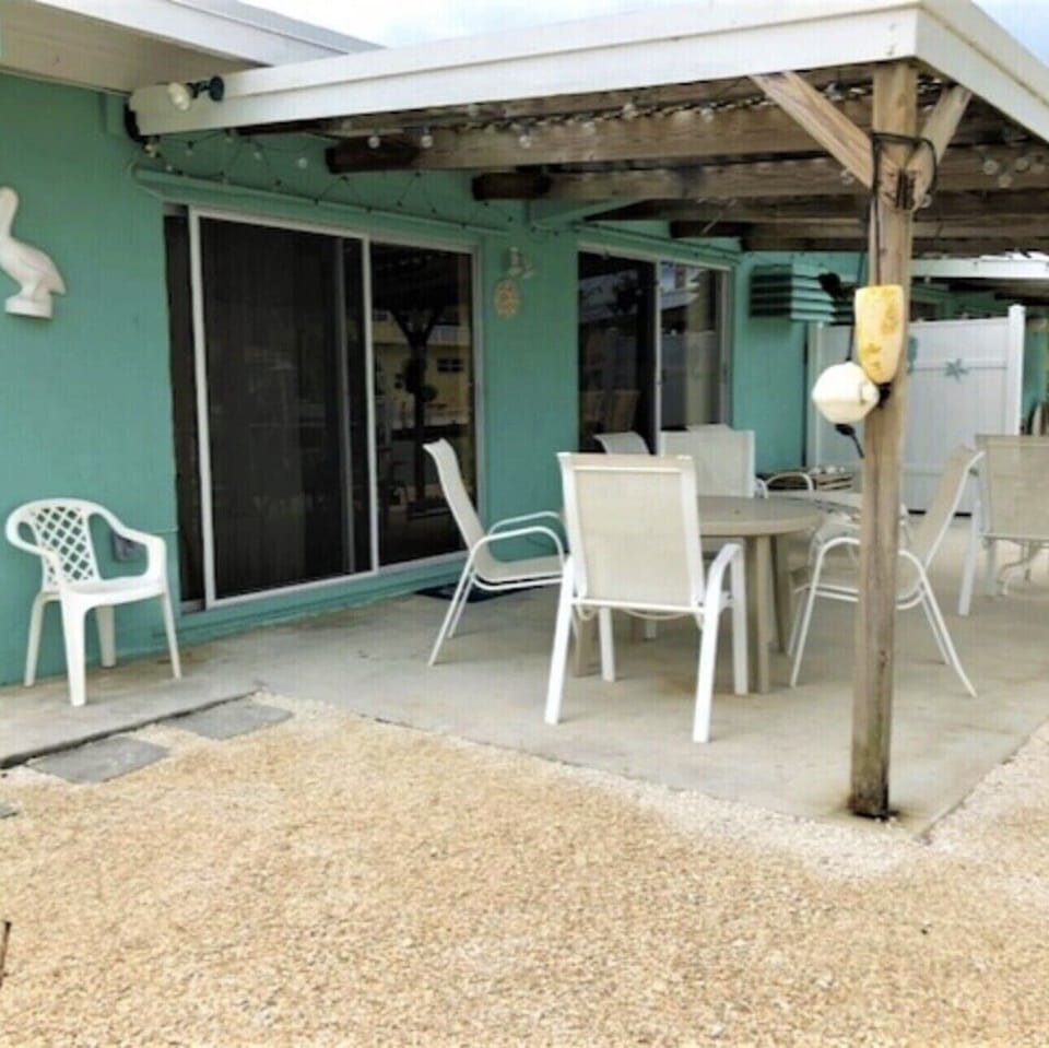 Shaded patio w/lighting, outside gas grill for dining. 