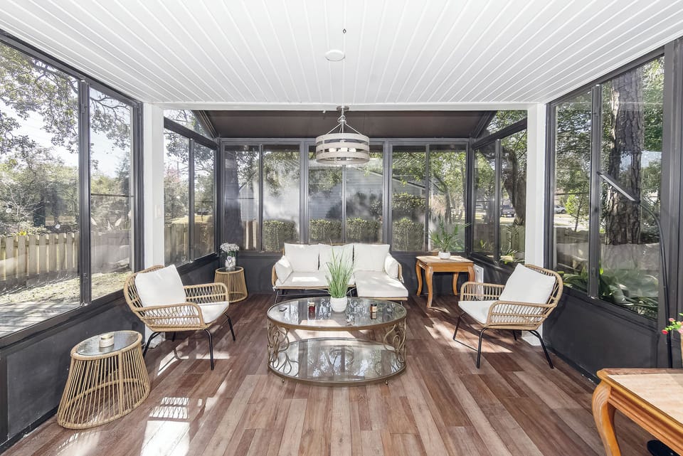 Relax in this sunroom surrounded by nature