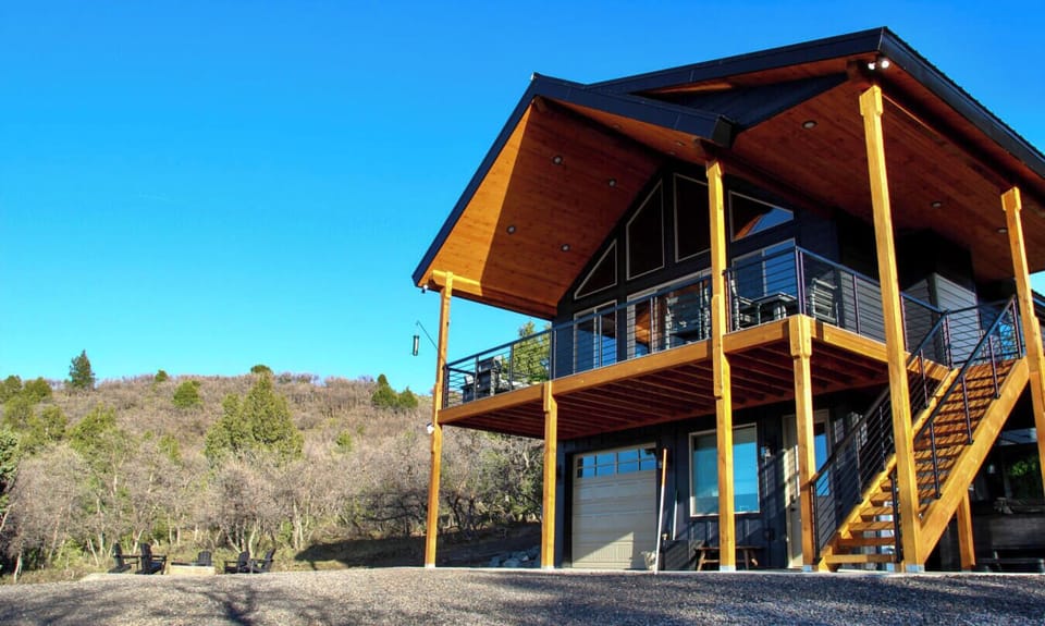 A cabin like no other. Sleek, modern, and perfectly tucked into the hillside. Book now!