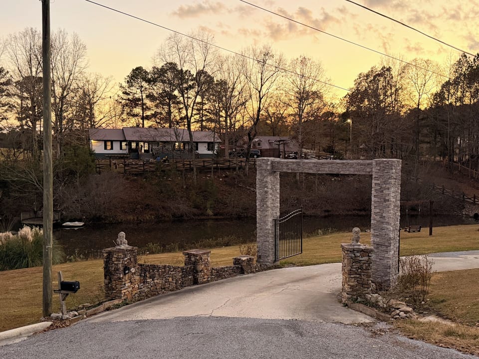Gated long driveway that leads to the house,with views of the lake. 13.6x15ft