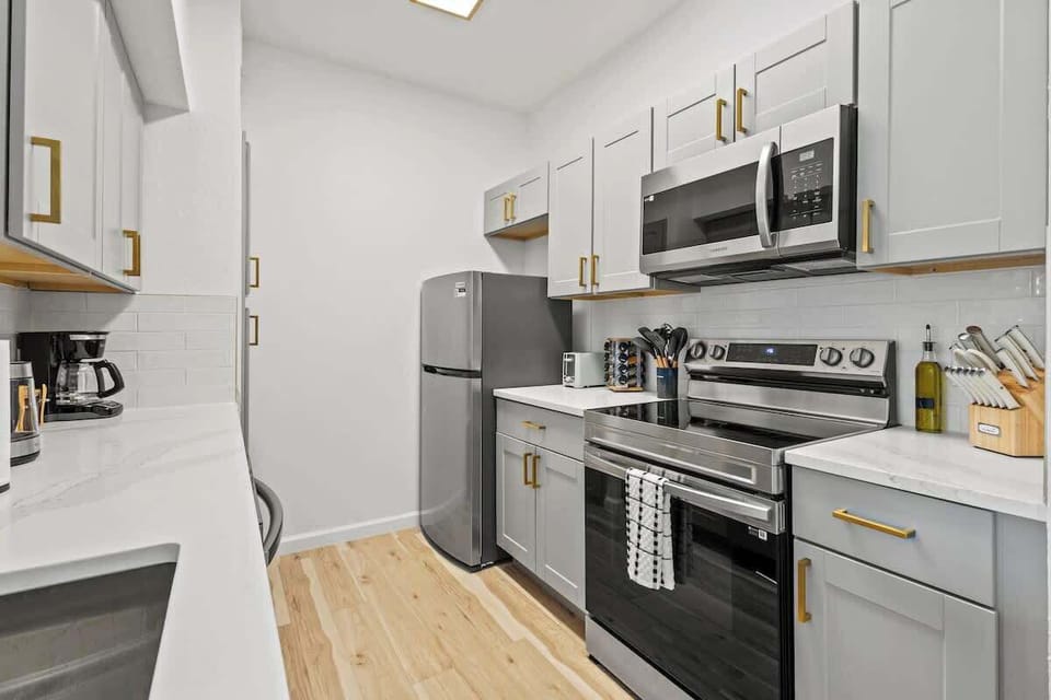 Bright kitchen with full appliances, spacious counters, and everything you need to cook meals with ease during your stay.