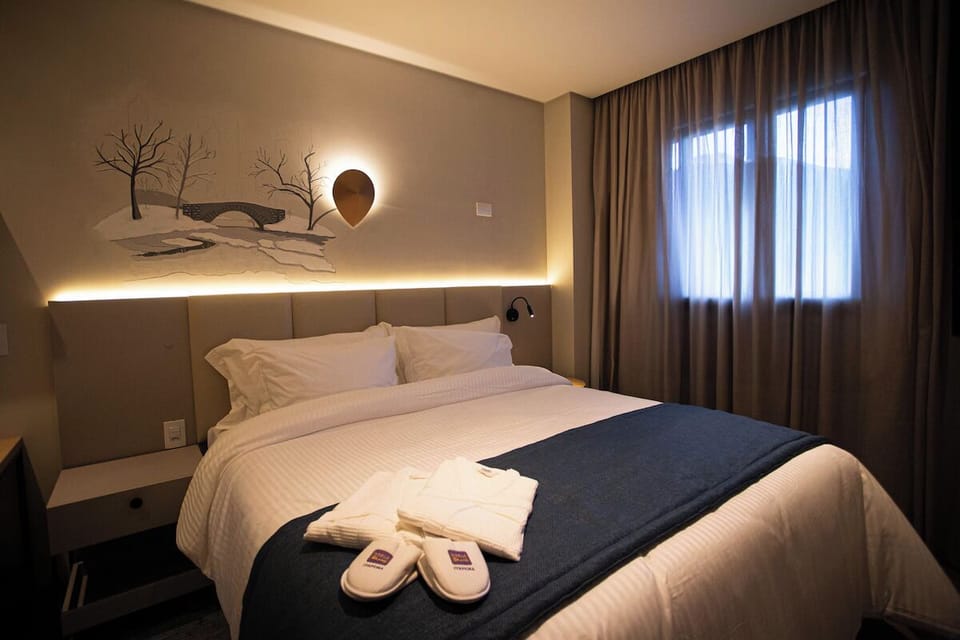 Sink into crisp linens and relax beneath warm ambient lighting.