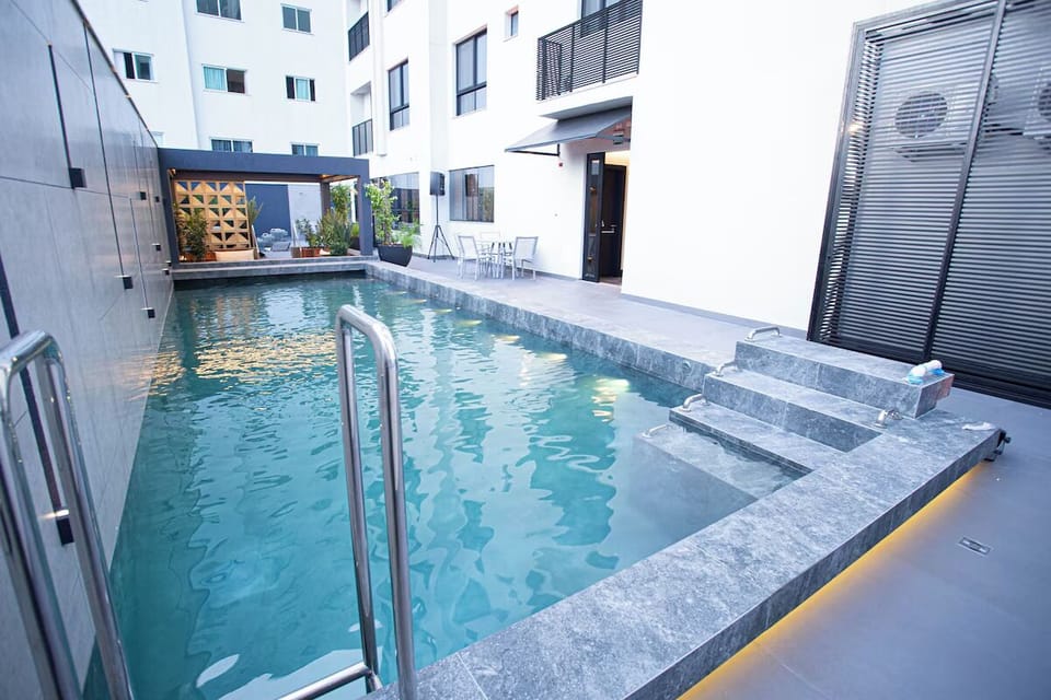 Dive into a sleek lap pool with city ambiance.