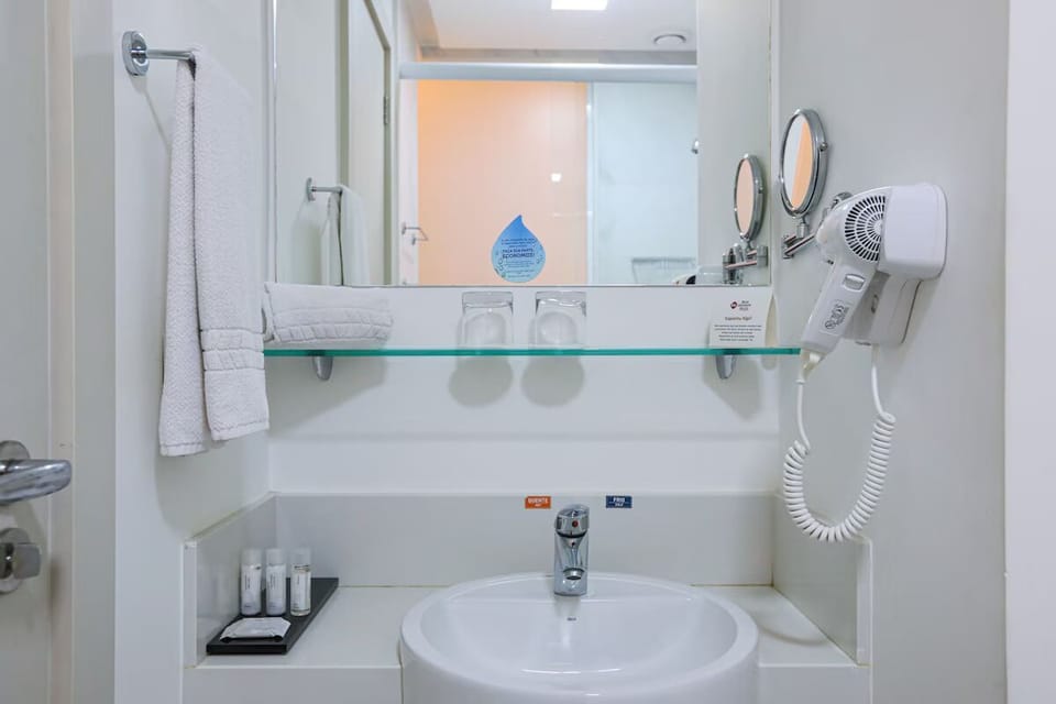 Refresh at the bright vanity with essentials ready for you.