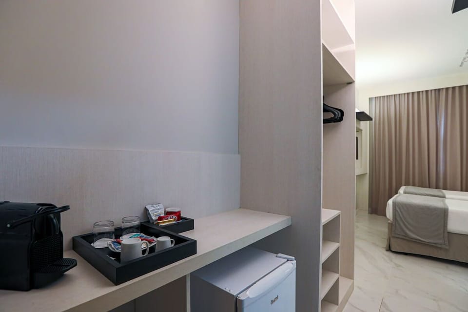 Start mornings with in-room coffee and chilled drinks nearby.