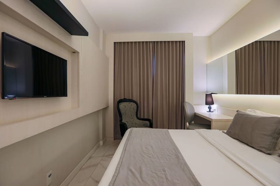 Unwind with your favorite shows from bed and armchair.