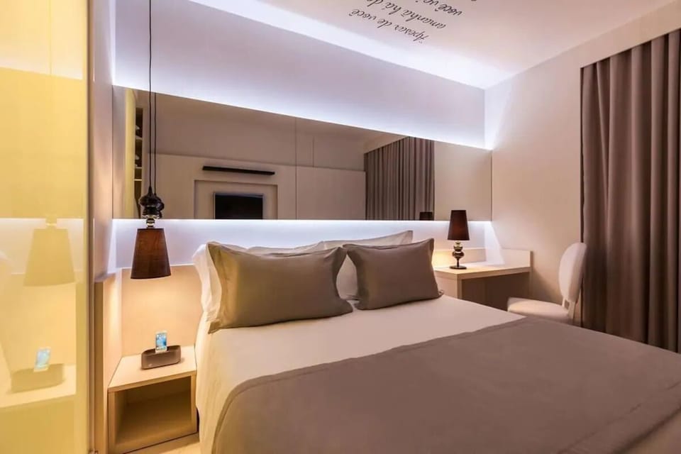 Sink into the plush bed under warm, relaxing ambient lights.