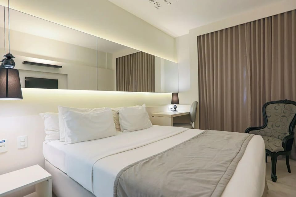 Stretch out in a serene, modern room with warm lighting.
