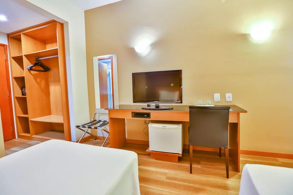Catch up on work with a dedicated desk and mini fridge.