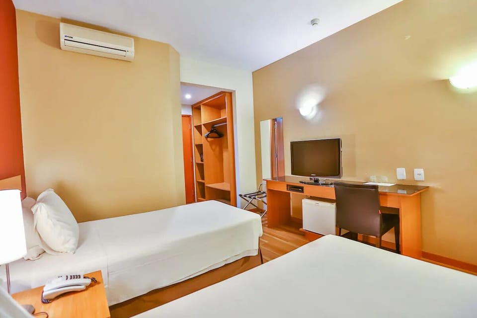 Stretch out and enjoy easy storage plus in-room workspace.