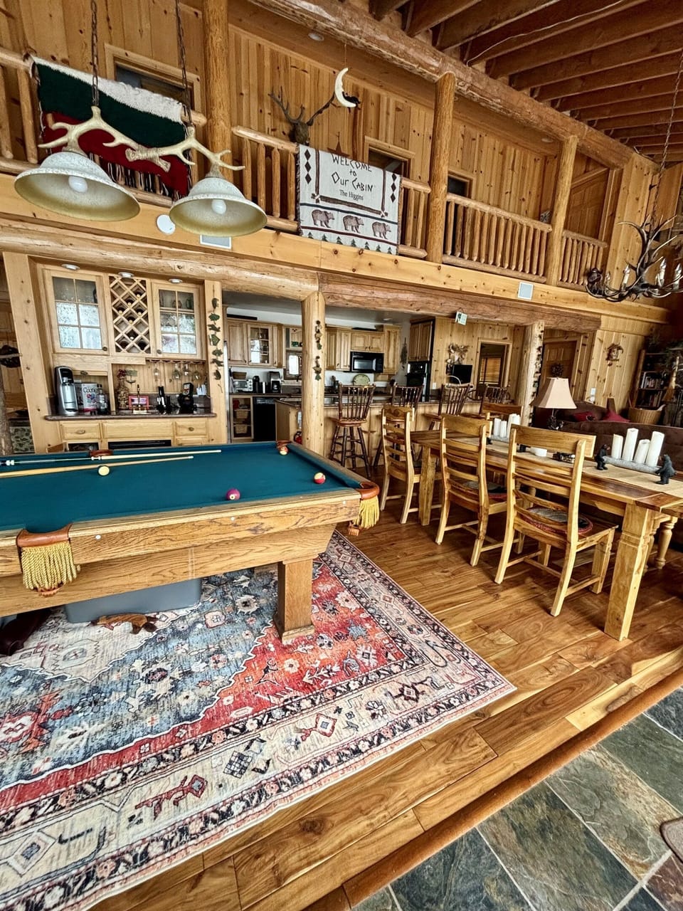 We have a pool table and separate bar area in our open concept cabin.  So, everyone in the group can have something to whatever the weather is ilke outside!