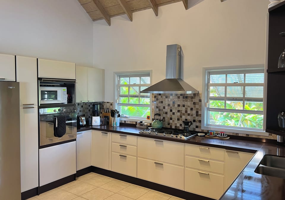 Fully equipped kitchen with modern appliances and ample space

