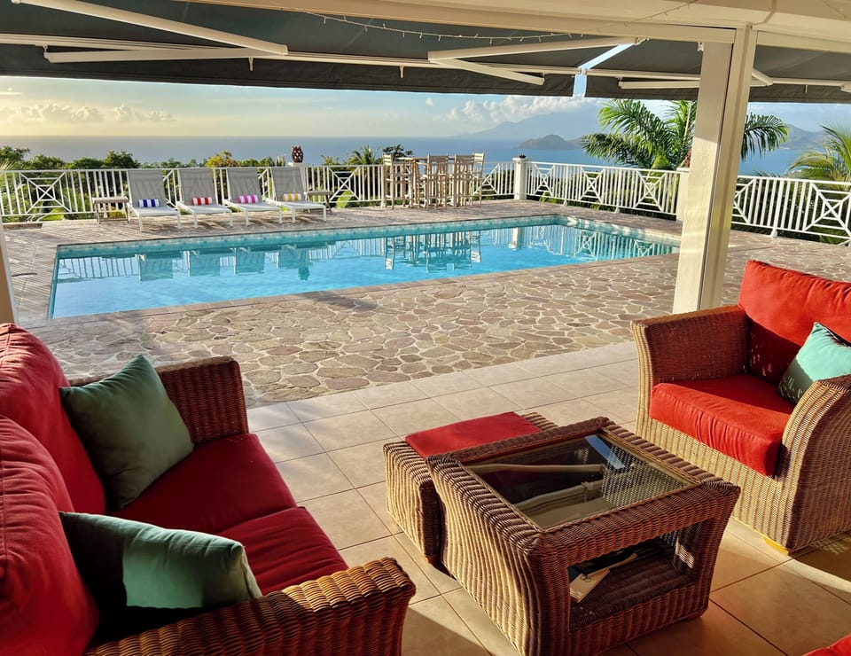 Covered Terrace Seating with Ocean and Pool Views