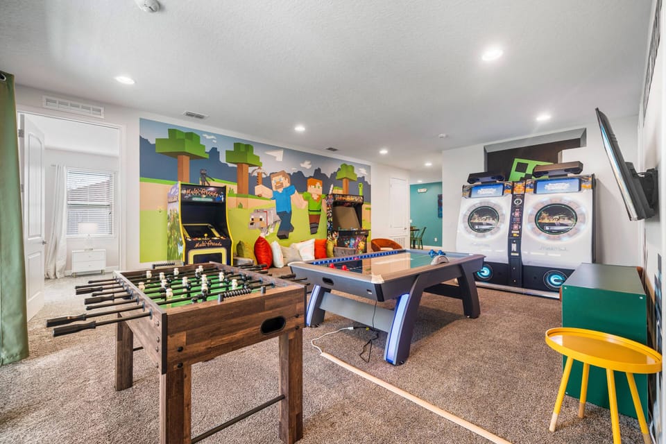 Game room with Air hockey, foosball, and arcades