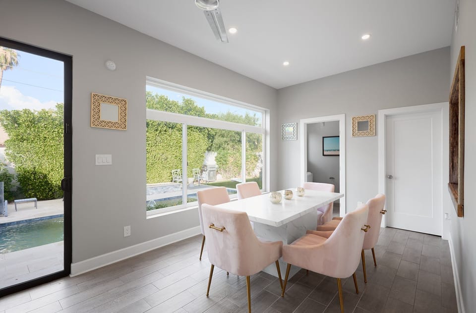 Private dining area with 6 chairs, half-bathroom, and private access to outdoor patio with pool.