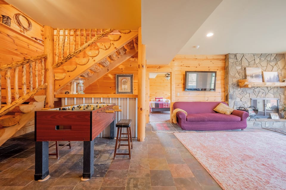 Game area with foosball table and cozy seating