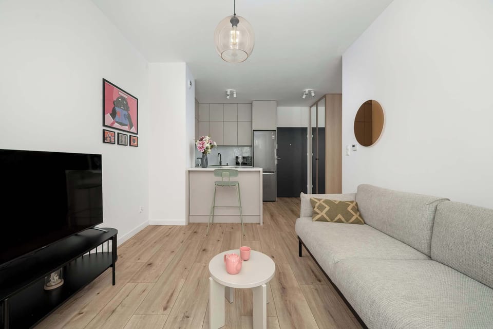 The living room's modern and stylish decor creates a welcoming atmosphere.
