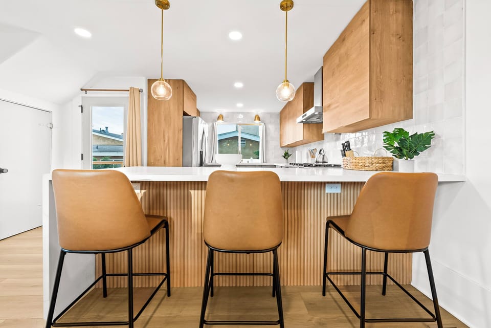 Cozy bar seating along the kitchen counter.