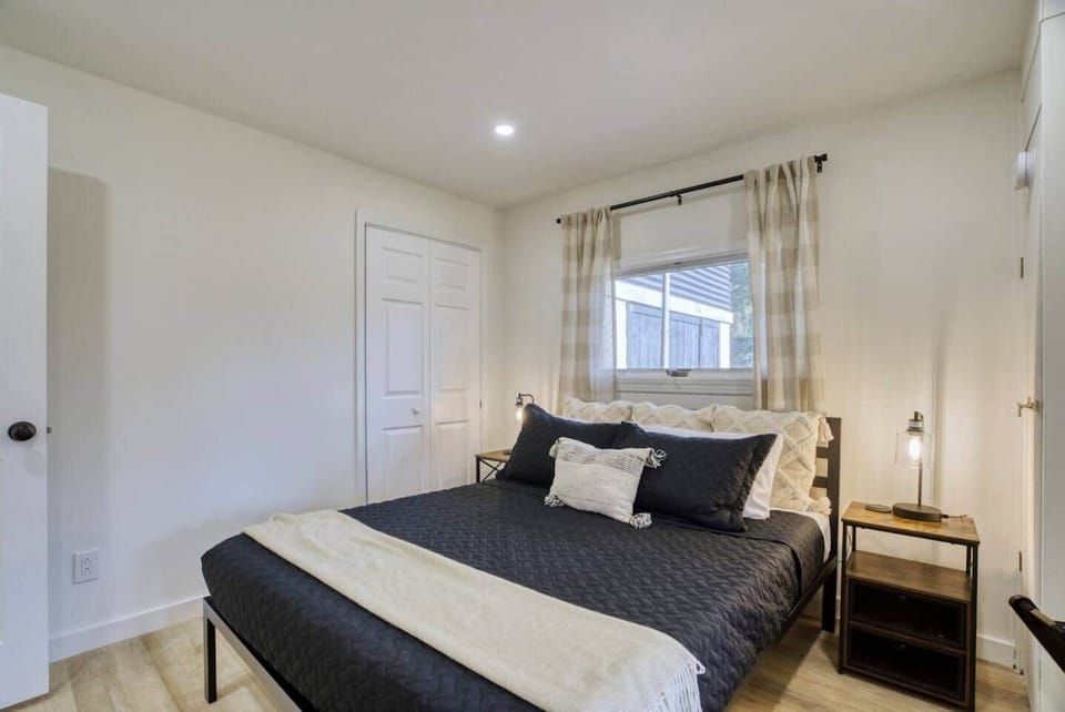 Cozy bedroom with soft lighting, fresh linens, and a peaceful space to unwind.
