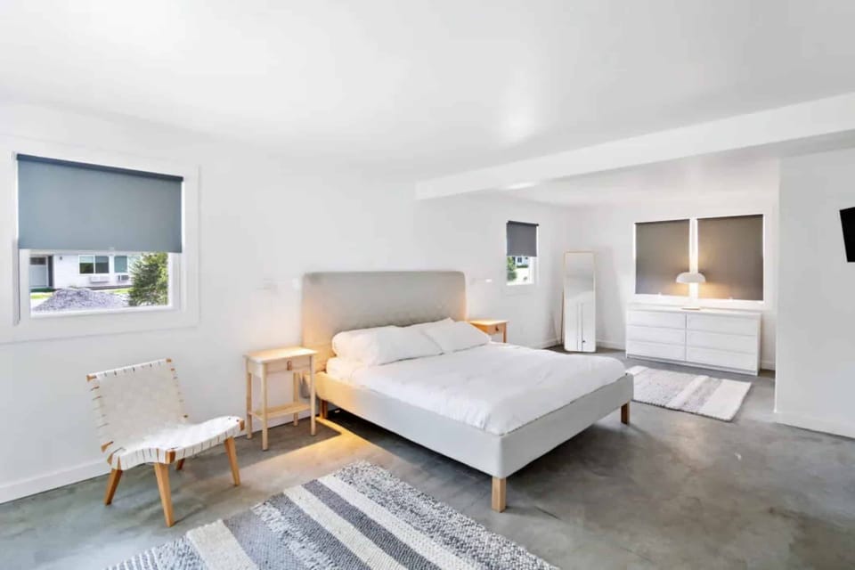 Linger in airy comfort with minimalist design and cozy textures.