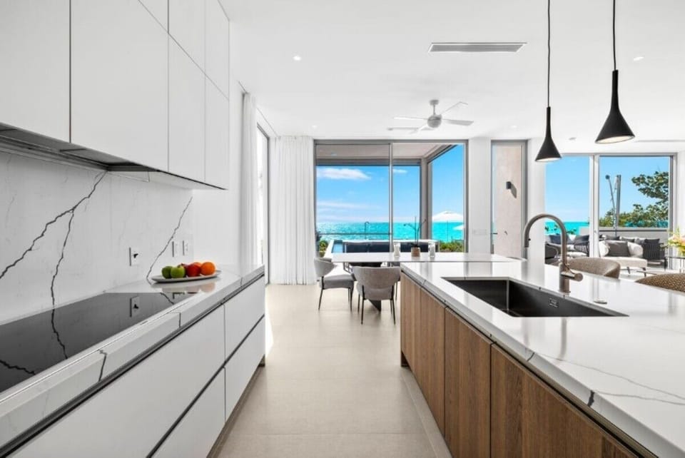 Cook together in the bright chef’s kitchen with open flow.