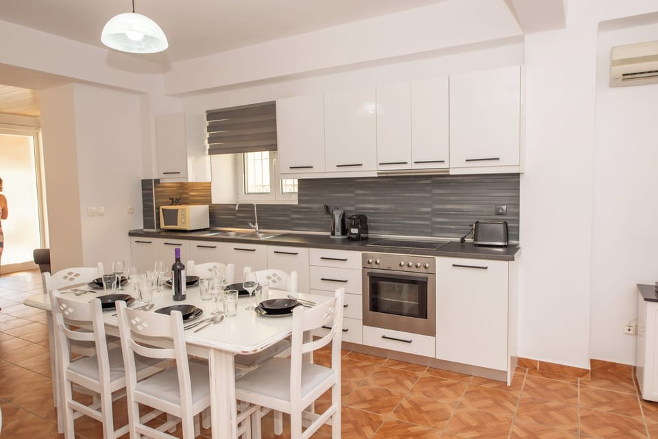 Paola House Agios Stefanos Kitchen And Dining Area 