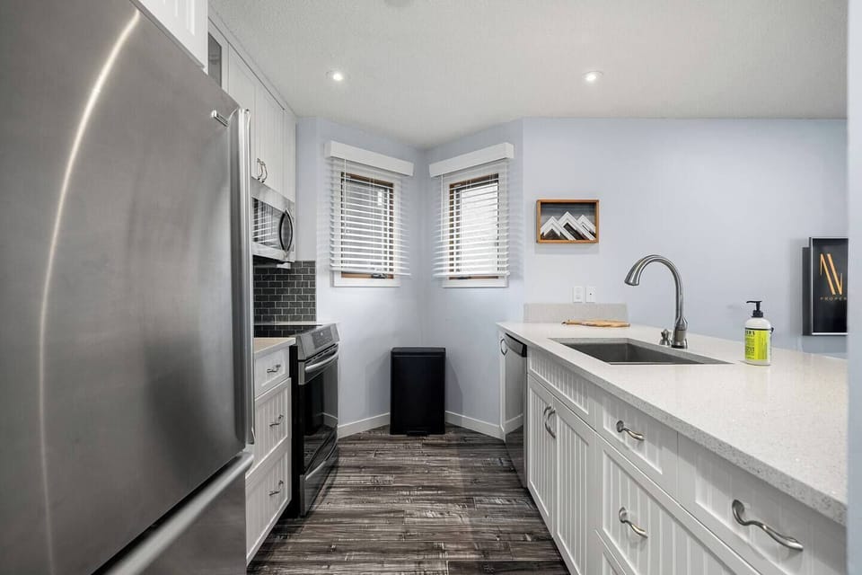 Full kitchen with a drip coffee maker, kettle, and all essentials (coffee grounds, sugar, tea, ketchup, mustard & relish.)