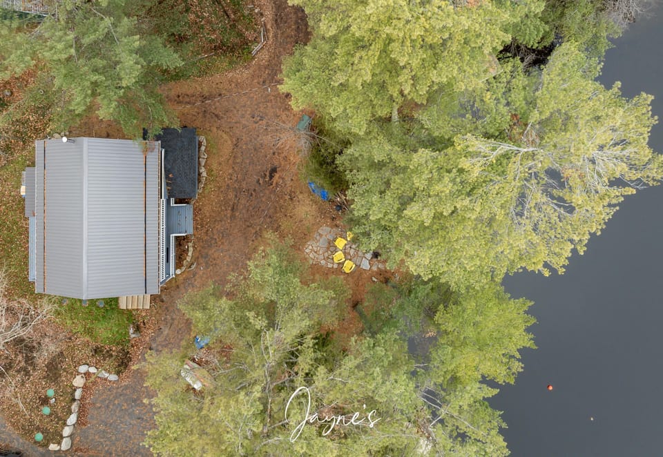 Secluded lakeside cabin with cozy fire pit retreat