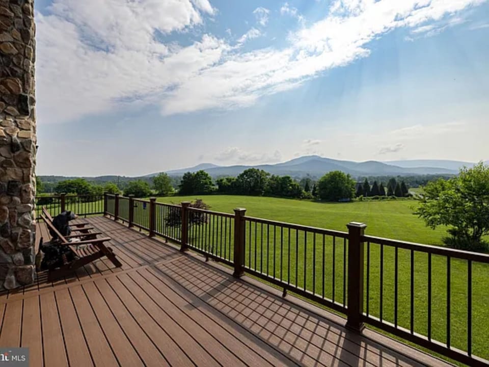 Soak in panoramic mountain views and peaceful green pastures from your expansive private deck, perfect for sunrise coffee or sunset lounging.