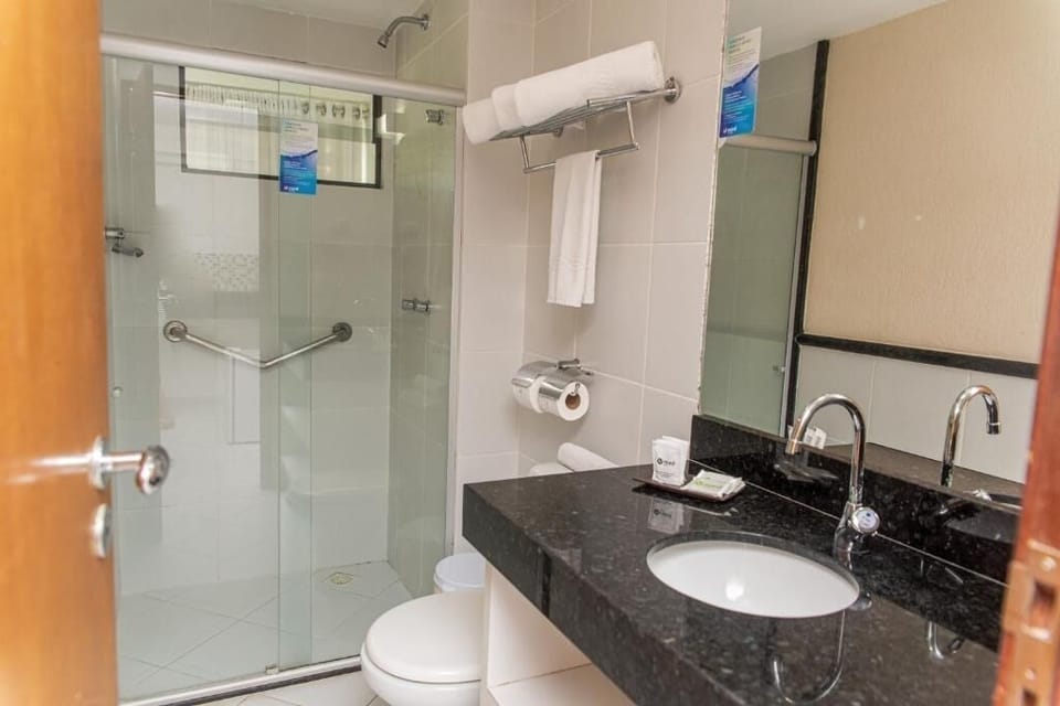 Refresh easily in a spotless shower with fresh towels ready.