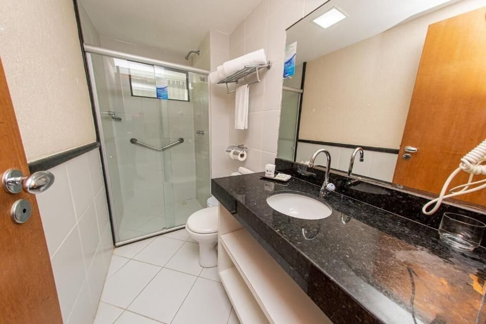 Step into a clean, modern bath with roomy vanity space.