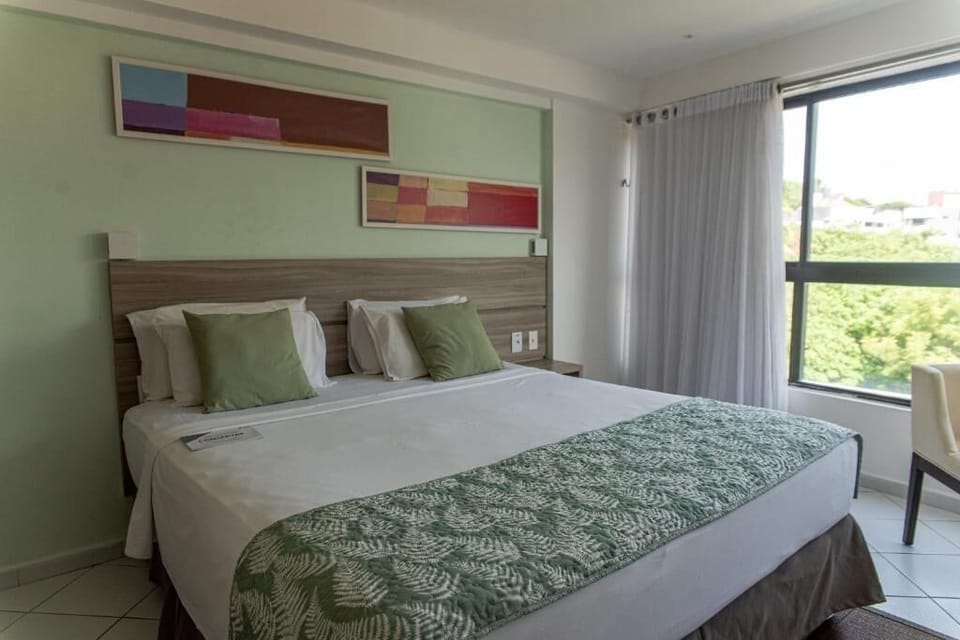 Sip coffee by the window while palm views fill the room.